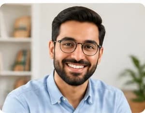 Rohit Sir, in glasses, in front of a bookshelf